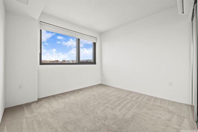 615 Keawe St Unit 3005, Honolulu, HI 96813 - carpeted spare room with a textured ceiling
