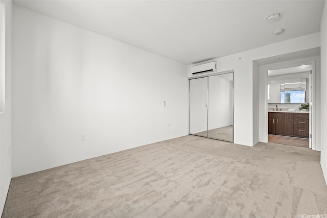 615 Keawe St Unit 3005, Honolulu, HI 96813 - unfurnished bedroom featuring a wall mounted air conditioner, light carpet, and a closet