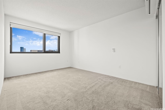 615 Keawe St Unit 3005, Honolulu, HI 96813 - unfurnished room with carpet and a textured ceiling
