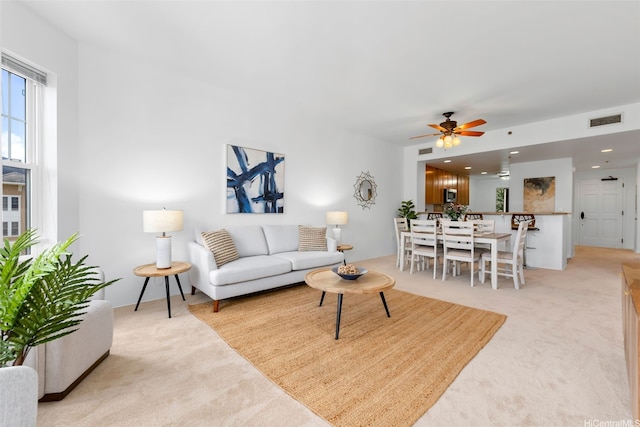 520 Lunalilo Home Rd Unit 6419, Honolulu, HI 96825 - living room with light carpet and ceiling fan