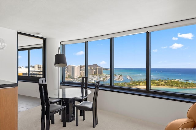 1330 Ala Moana Blvd Unit 3305, Honolulu, HI 96814 - dining room with light carpet, healthy amount of natural light, and a water view