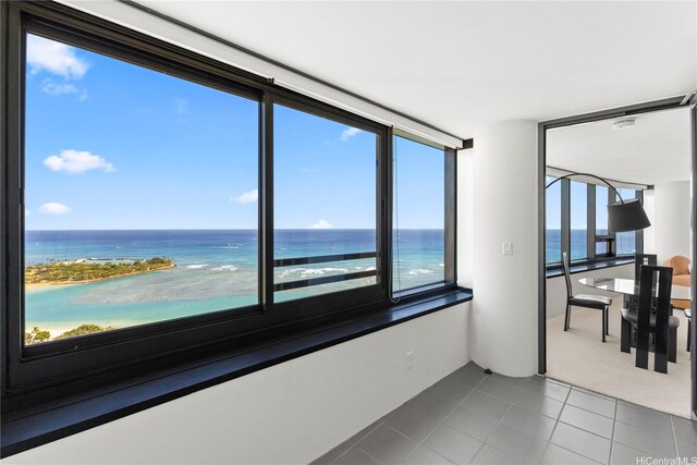 1330 Ala Moana Blvd Unit 3305, Honolulu, HI 96814 - tiled spare room with a water view and carpet flooring