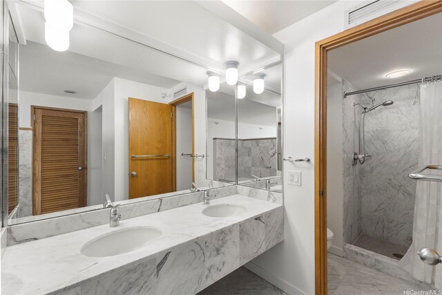 1330 Ala Moana Blvd Unit 3305, Honolulu, HI 96814 - full bath with double vanity, marble finish flooring, and a marble finish shower