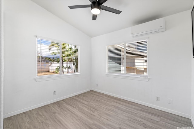 87-1106 Oheohe St, Waianae, HI 96792 - unfurnished room with a wall mounted AC, wood finished floors, vaulted ceiling, and ceiling fan