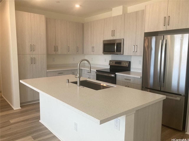 91-1101 Franklin D Roosevelt Ave Unit 365, Kapolei, HI 96707 - kitchen featuring appliances with stainless steel finishes, light brown cabinets, an island with sink, wood finished floors, and recessed lighting