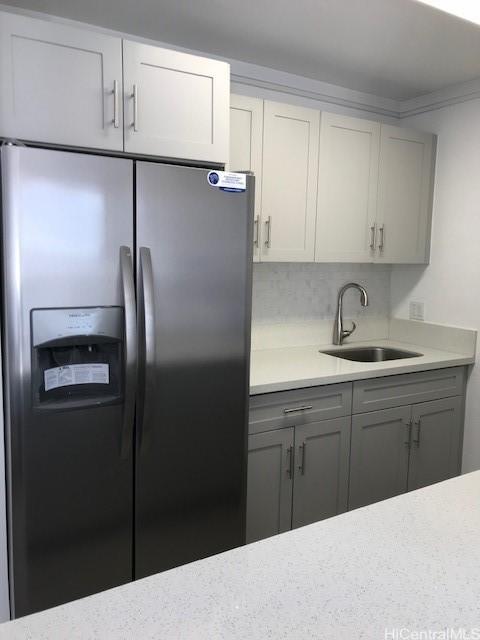 775 Kinalau Pl Unit 1204, Honolulu, HI 96813 - kitchen featuring stainless steel refrigerator with ice dispenser, light countertops, and gray cabinets