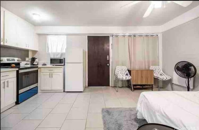 410 Nahua St Unit 204, Honolulu, HI 96815 - bedroom with freestanding refrigerator and light tile patterned flooring