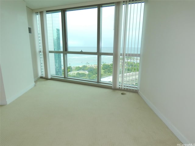 1177 Queen St Unit 3405, Honolulu, HI 96814 - empty room with carpet flooring, a water view, and healthy amount of natural light
