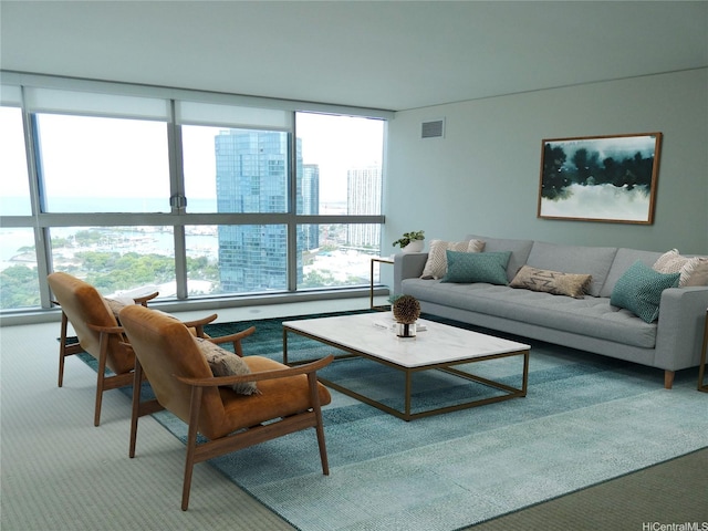 1177 Queen St Unit 3405, Honolulu, HI 96814 - carpeted living room with healthy amount of natural light and a wall of windows