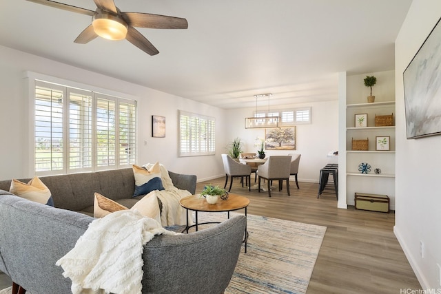 91-497 Kuhialoko St, Ewa Beach, HI 96706 - living area featuring light wood-type flooring and a ceiling fan