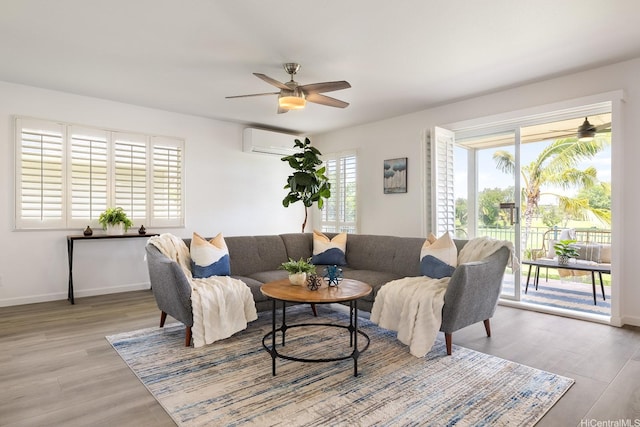 91-497 Kuhialoko St, Ewa Beach, HI 96706 - living room with a ceiling fan, light wood-style floors, and a wall unit AC