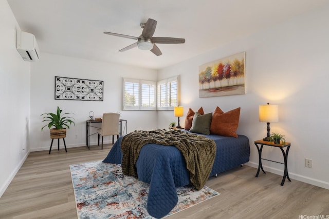 91-497 Kuhialoko St, Ewa Beach, HI 96706 - bedroom with light wood-type flooring, a ceiling fan, and an AC wall unit