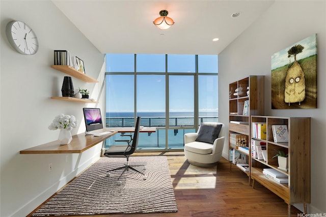 1189 Waimanu St Unit 4301, Honolulu, HI 96814 - home office with expansive windows, wood finished floors, and built in desk