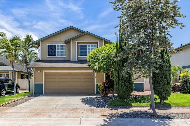91-324 Kailike Pl, Ewa Beach, HI 96706 - view of front of home featuring a garage, driveway, and stucco siding