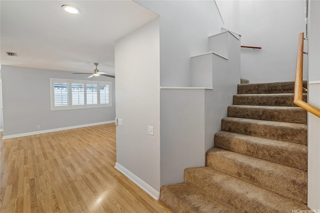 91-324 Kailike Pl, Ewa Beach, HI 96706 - staircase with wood finished floors and ceiling fan