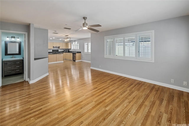 91-324 Kailike Pl, Ewa Beach, HI 96706 - unfurnished living room featuring light wood-style floors, a ceiling fan, and a chandelier