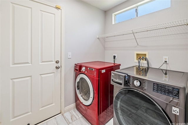 91-324 Kailike Pl, Ewa Beach, HI 96706 - washroom featuring washing machine and clothes dryer and light marble finish flooring