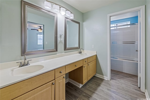 91-324 Kailike Pl, Ewa Beach, HI 96706 - bathroom featuring healthy amount of natural light, double vanity, wood finished floors, and tiled shower / bath