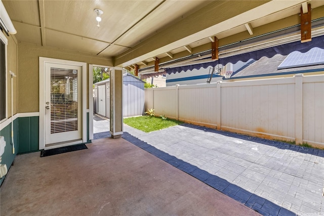 91-324 Kailike Pl, Ewa Beach, HI 96706 - fenced backyard featuring a storage unit and a patio area
