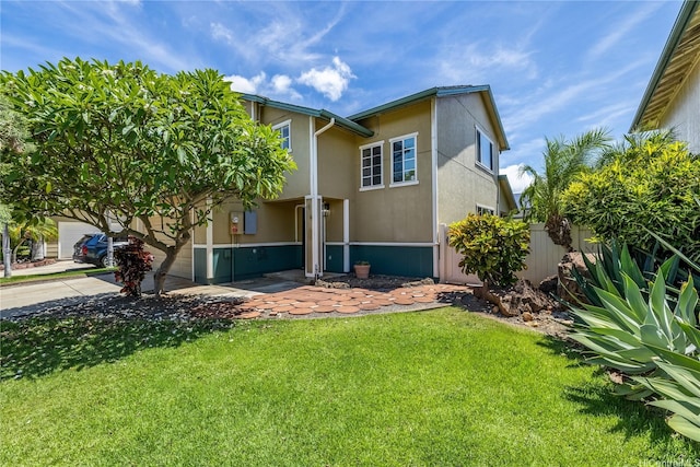 91-324 Kailike Pl, Ewa Beach, HI 96706 - view of front of home featuring a front yard and stucco siding
