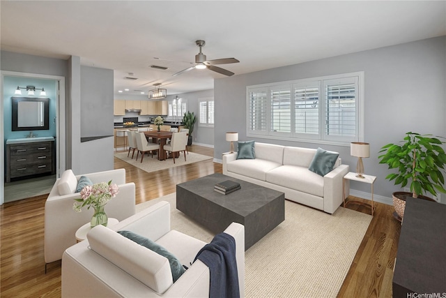 91-324 Kailike Pl, Ewa Beach, HI 96706 - living area with a ceiling fan and light wood-type flooring