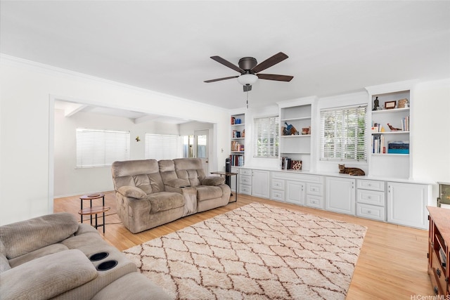 356 Opihikao Pl Unit 542, Honolulu, HI 96825 - living area with ceiling fan, light wood-style floors, and crown molding