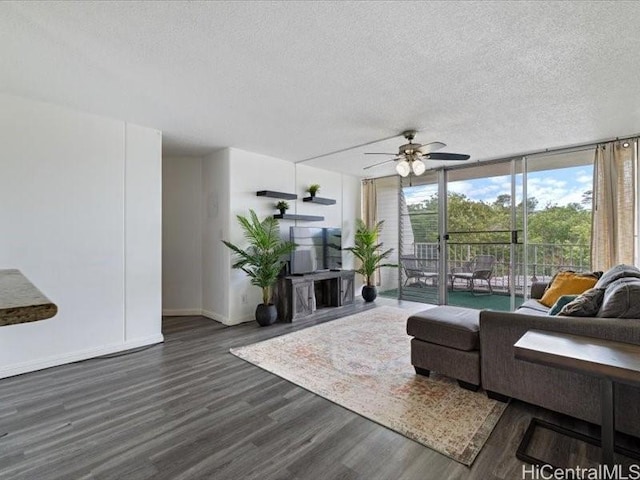 95-2055 Waikalani Pl Unit B404, Mililani, HI 96789 - living room featuring wood finished floors, a textured ceiling, ceiling fan, and expansive windows