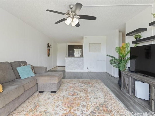95-2055 Waikalani Pl Unit B404, Mililani, HI 96789 - living room with wood finished floors and ceiling fan