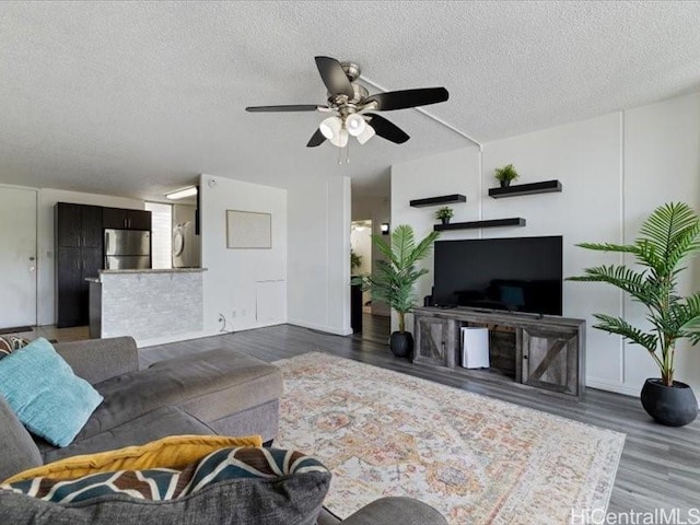 95-2055 Waikalani Pl Unit B404, Mililani, HI 96789 - living area with wood finished floors, a textured ceiling, and ceiling fan