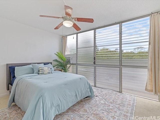 95-2055 Waikalani Pl Unit B404, Mililani, HI 96789 - bedroom with a ceiling fan and light carpet