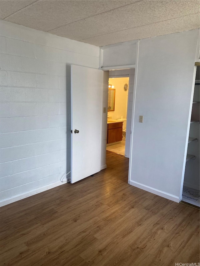 2015 Wilder Ave Unit 3C, Honolulu, HI 96822 - unfurnished bedroom featuring dark wood finished floors and baseboards