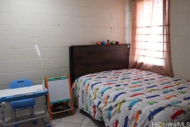 94-245 Leowahine St Unit 3009, Waipahu, HI 96797 - bedroom featuring multiple windows, light tile patterned floors, and concrete block wall