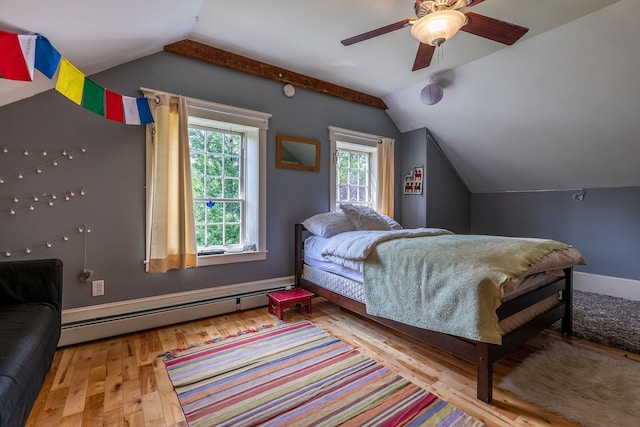 bedroom with a baseboard heating unit, lofted ceiling, light wood-type flooring, and ceiling fan