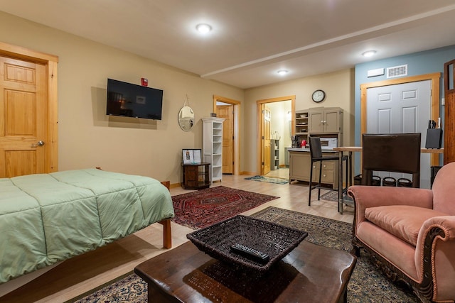 bedroom with light hardwood / wood-style floors