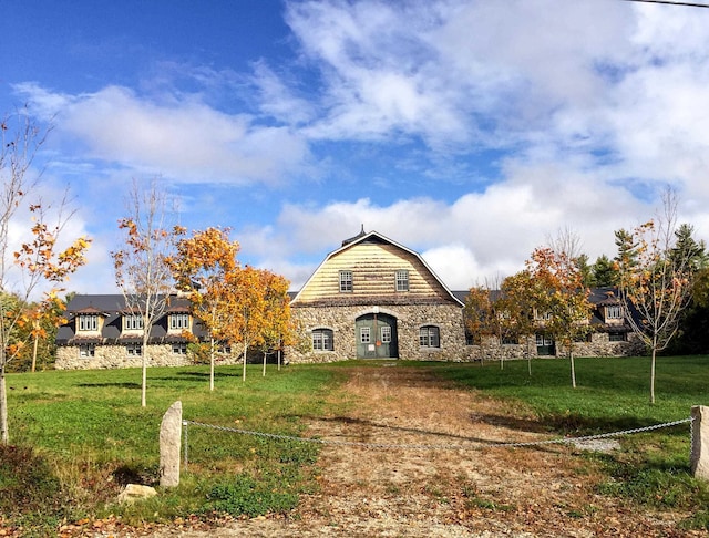 view of home's community with a lawn