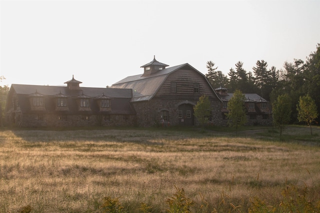 view of side of home with a lawn