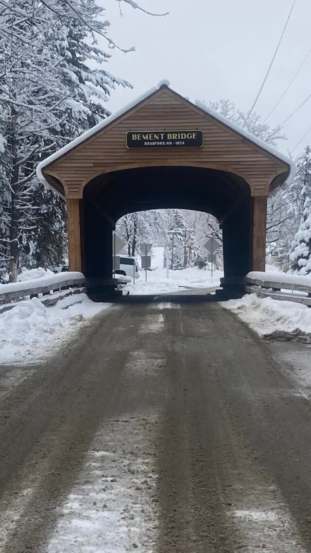 view of snow covered parking area