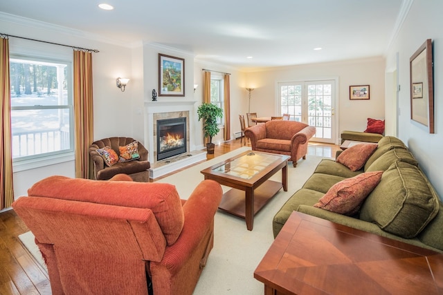 living room featuring crown molding and light hardwood / wood-style flooring