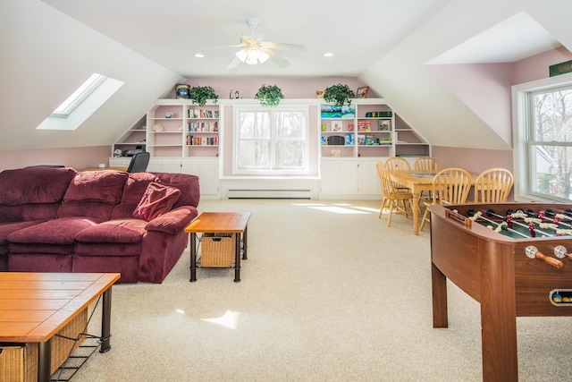 game room featuring light colored carpet and vaulted ceiling with skylight