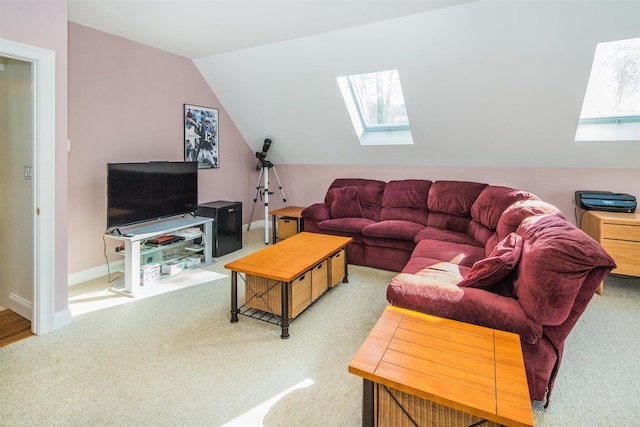 living room featuring vaulted ceiling with skylight and light colored carpet