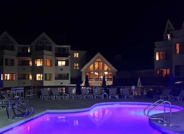 view of pool at night