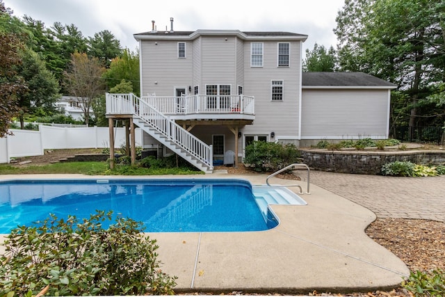 view of pool with a deck and a patio area