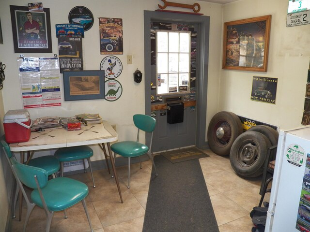 laundry room with light tile floors