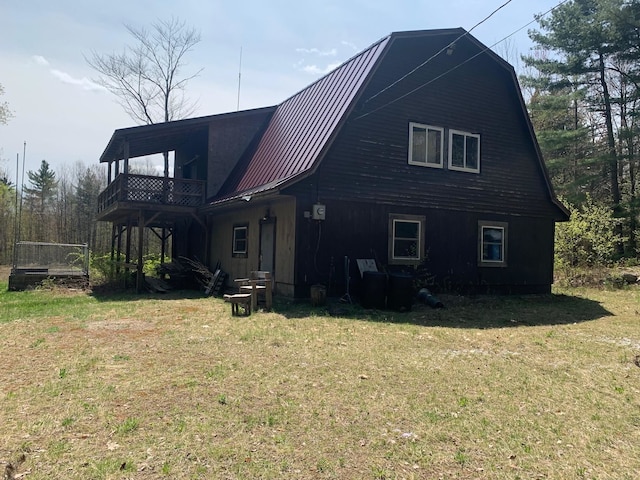275 Mica Mine Rd, Unity, NH 03743 - back of property with a balcony and a lawn