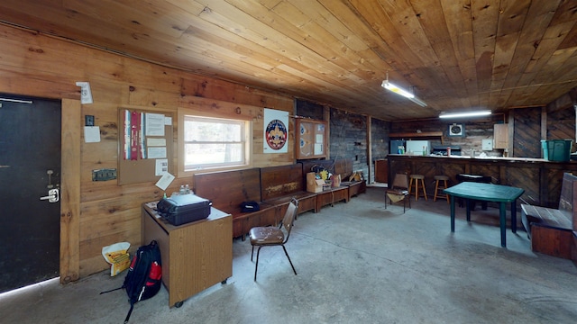 275 Mica Mine Rd, Unity, NH 03743 - interior space with wood walls, concrete flooring, and wood ceiling