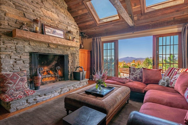 living room featuring a fireplace, dark hardwood / wood-style flooring, a skylight, high vaulted ceiling, and wooden ceiling