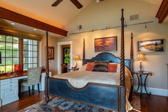 bedroom with dark wood-type flooring, high vaulted ceiling, rail lighting, built in desk, and ceiling fan