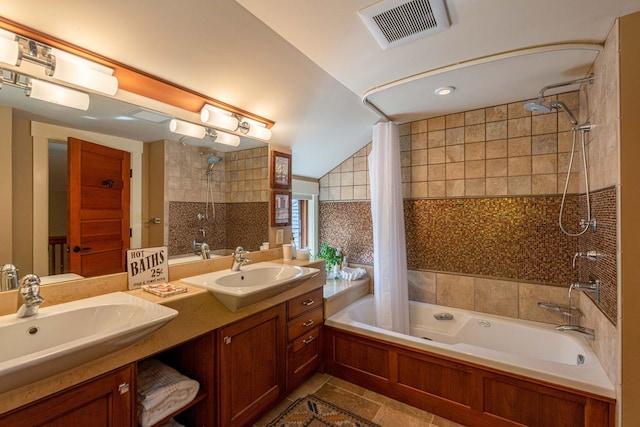 bathroom with tiled shower / bath combo, lofted ceiling, dual vanity, and tile flooring