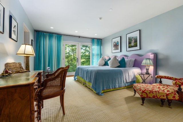 bedroom featuring light colored carpet