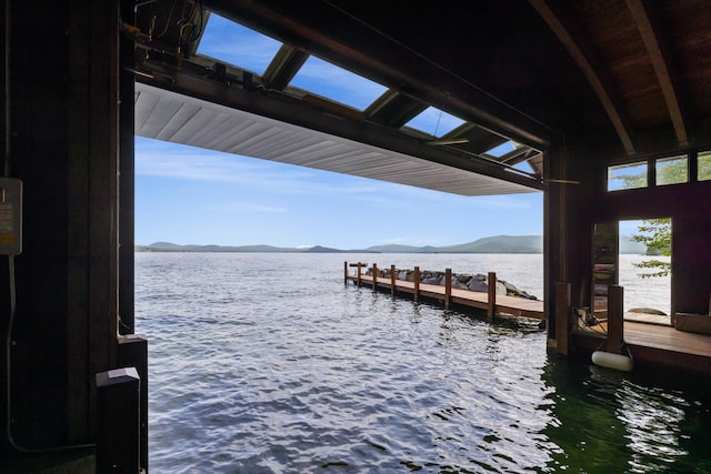 dock area with a water and mountain view